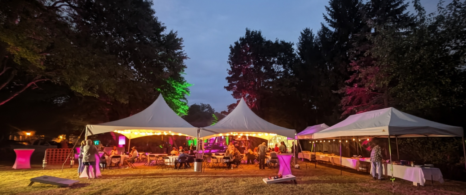 Tent rental setup for an evening outdoor event in Aurora Ohio
